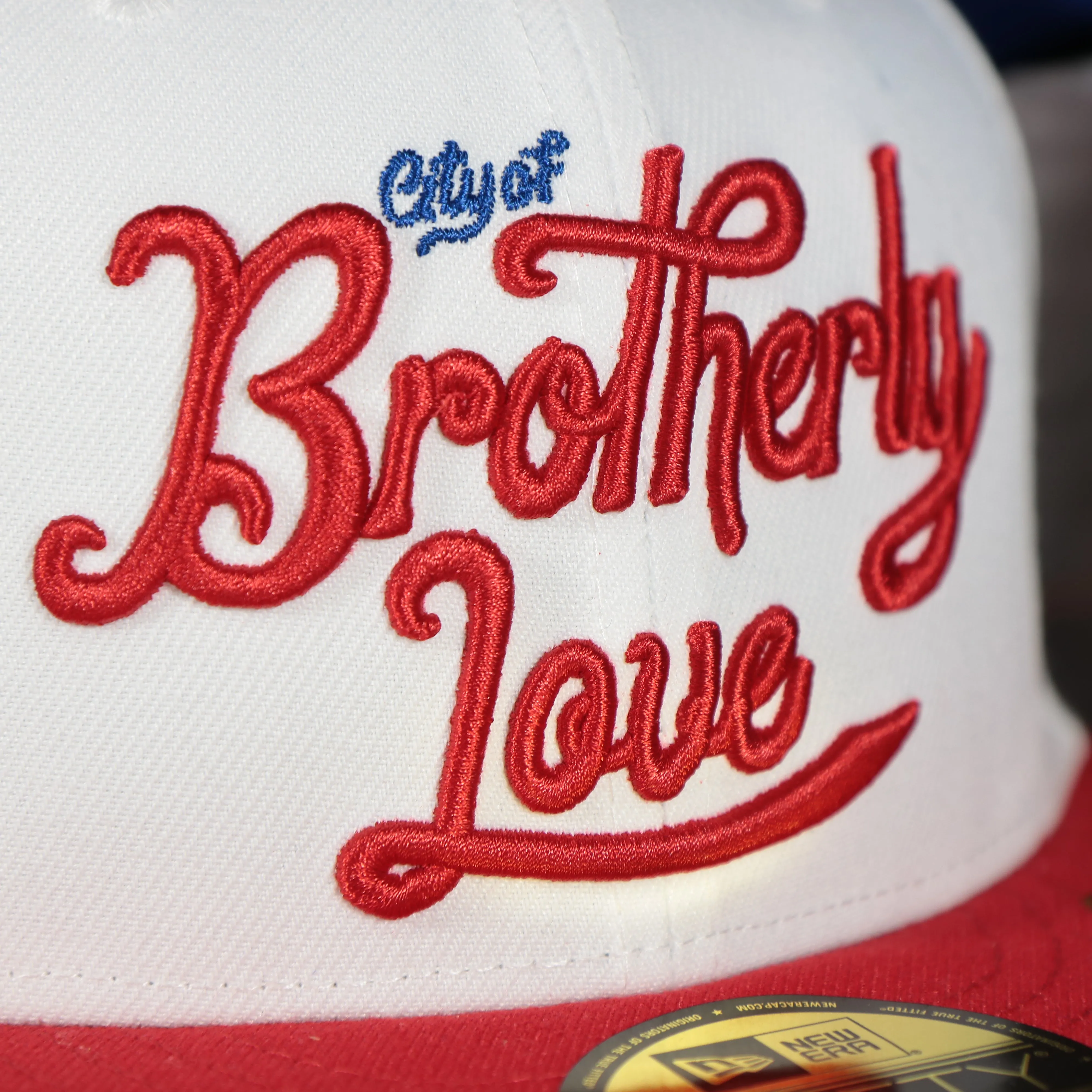 Philadelphia 76ers 2022 City Edition City Of Brotherly Love Blue Bottom 59Fifty Side Patch Fitted Cap | New Era, White