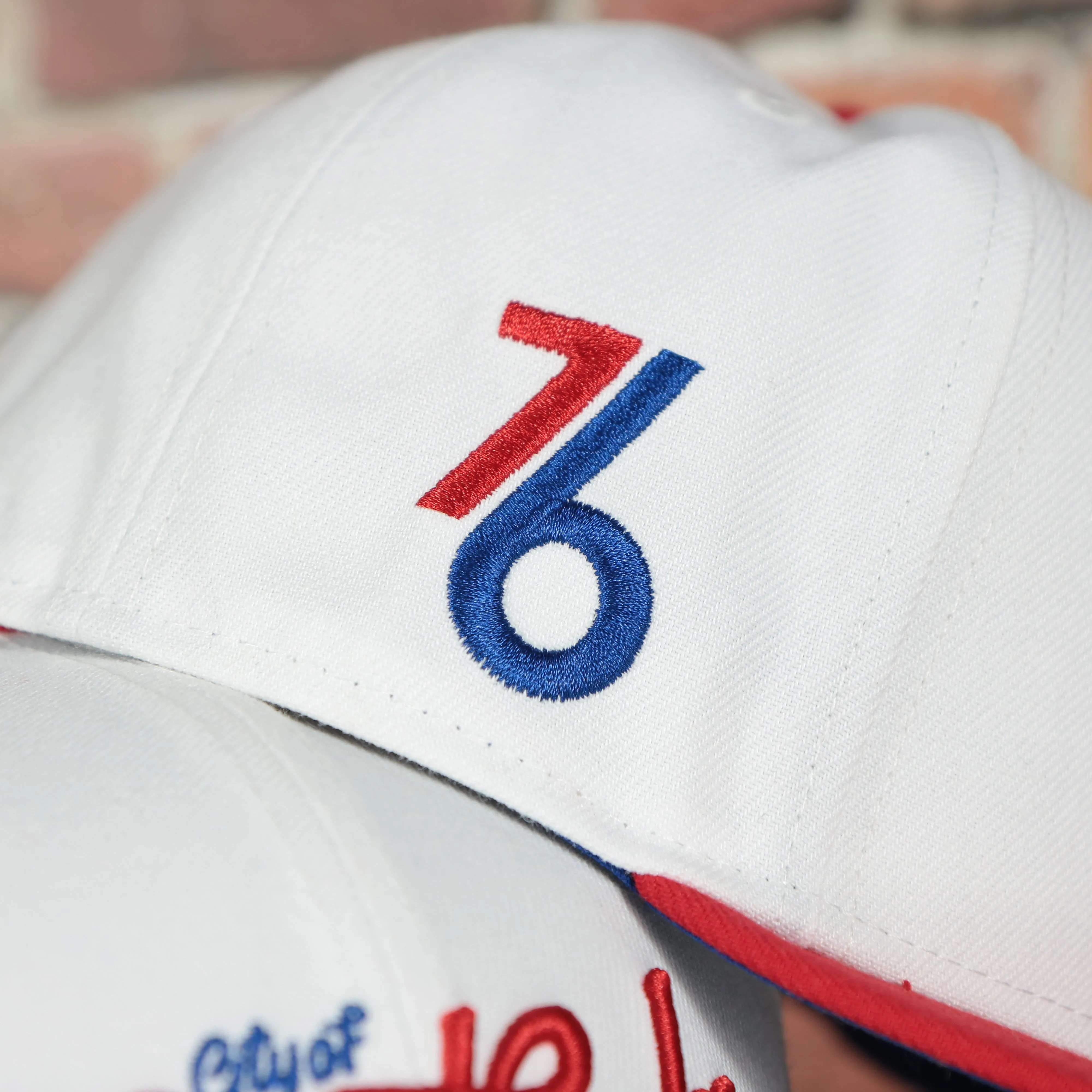 Philadelphia 76ers 2022 City Edition City Of Brotherly Love Blue Bottom 59Fifty Side Patch Fitted Cap | New Era, White